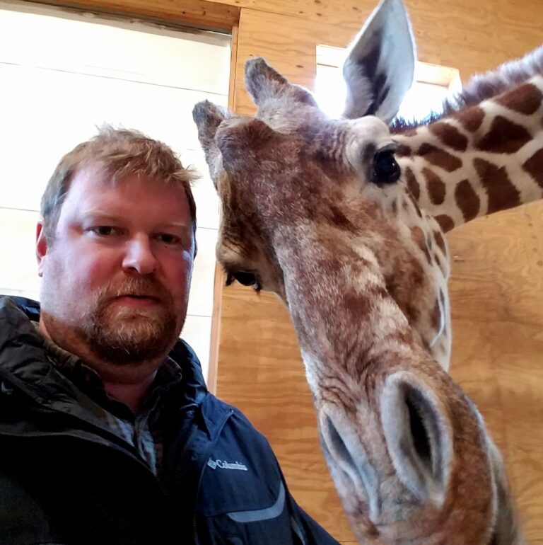 Dr. Tim with April the Giraffe.